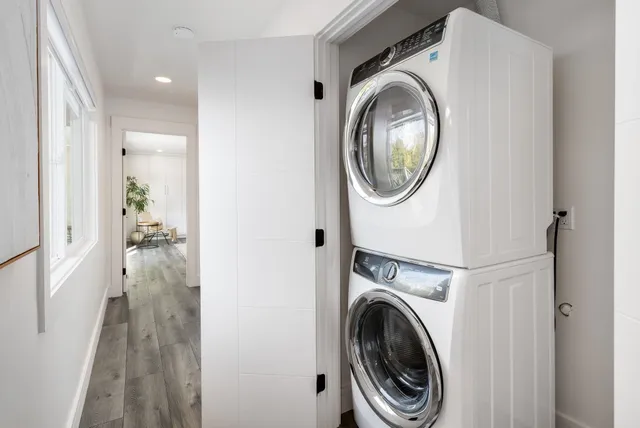a view of a hallway with washer and dryer