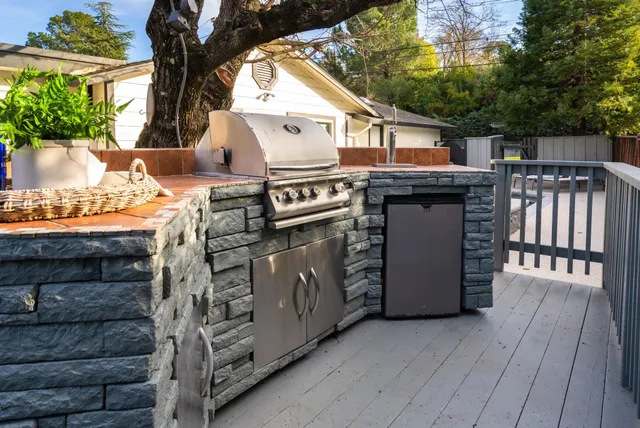 a view of a chair and table on the deck