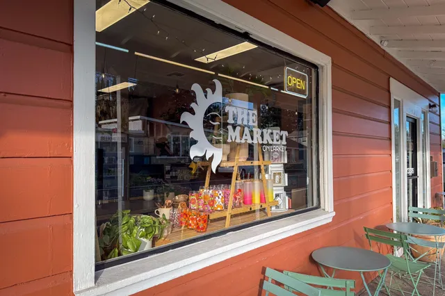 a picture of a bathroom with a shower