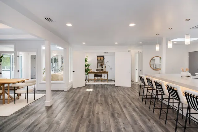 a view of kitchen with cabinets and wooden floor