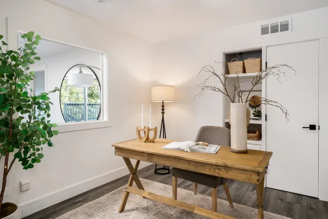 a workspace with furniture and window