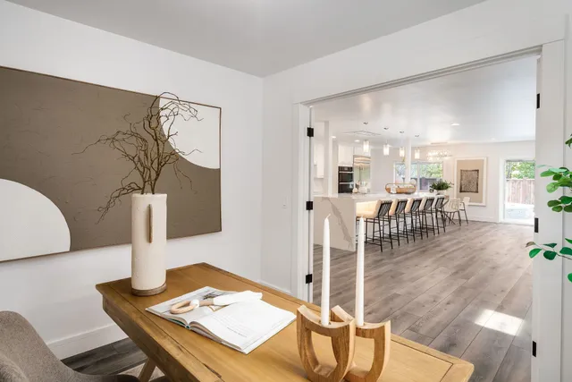 a living room with furniture and a table