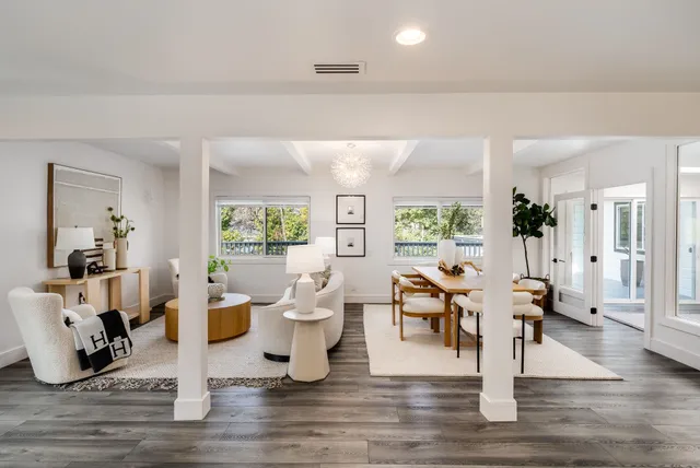 a living room with fireplace furniture and a wooden floor