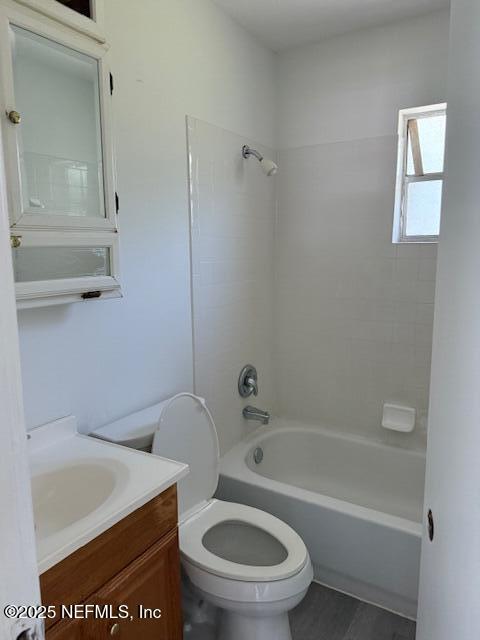 9504 Flechette Avenue Jacksonville, FL 32208 - Photo 12 of 14 a white toilet sitting next to a bath tub