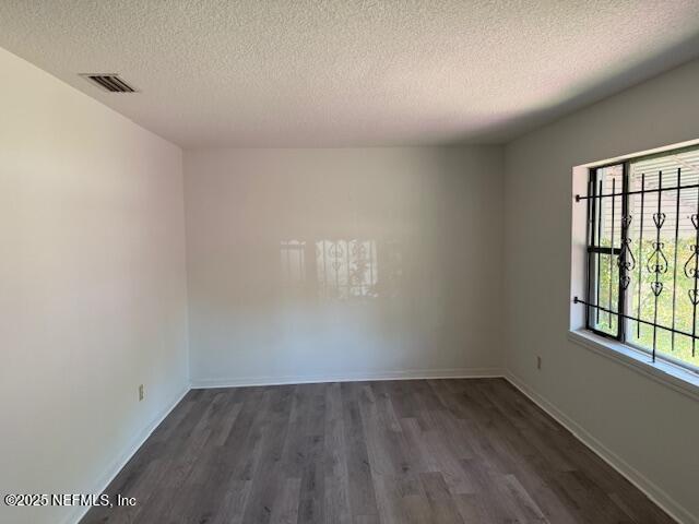 9504 Flechette Avenue Jacksonville, FL 32208 - Photo 4 of 14 an empty room with a window