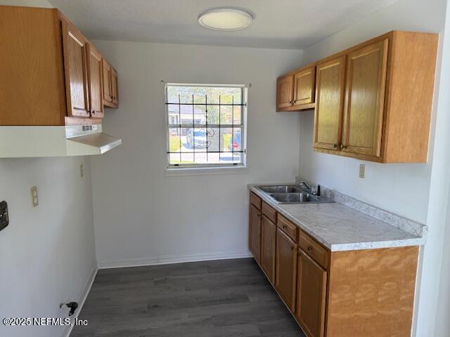 9504 Flechette Avenue Jacksonville, FL 32208 - Photo 6 of 14 a kitchen with granite countertop wooden cabinets and sink