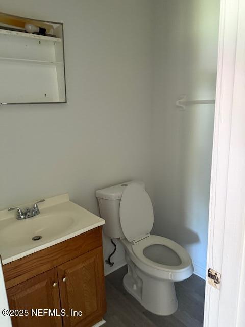 9504 Flechette Avenue Jacksonville, FL 32208 - Photo 9 of 14 a bathroom with a toilet and a sink
