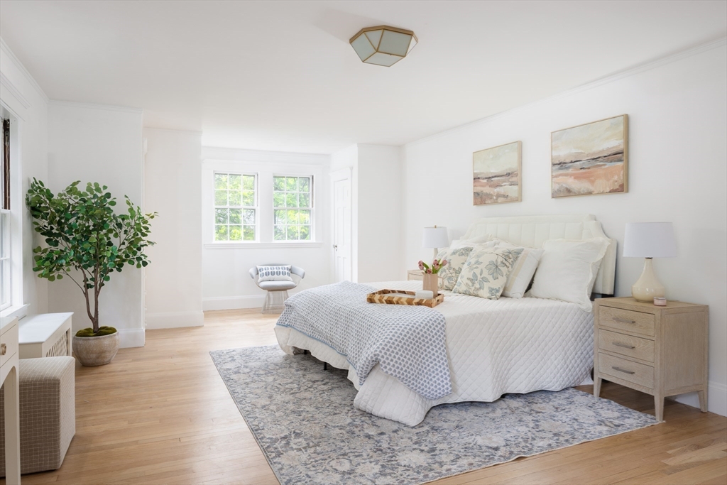 37 Randolph Road Brookline, MA 02467 - Photo 11 of 20 a bed room with a bed and a potted plant