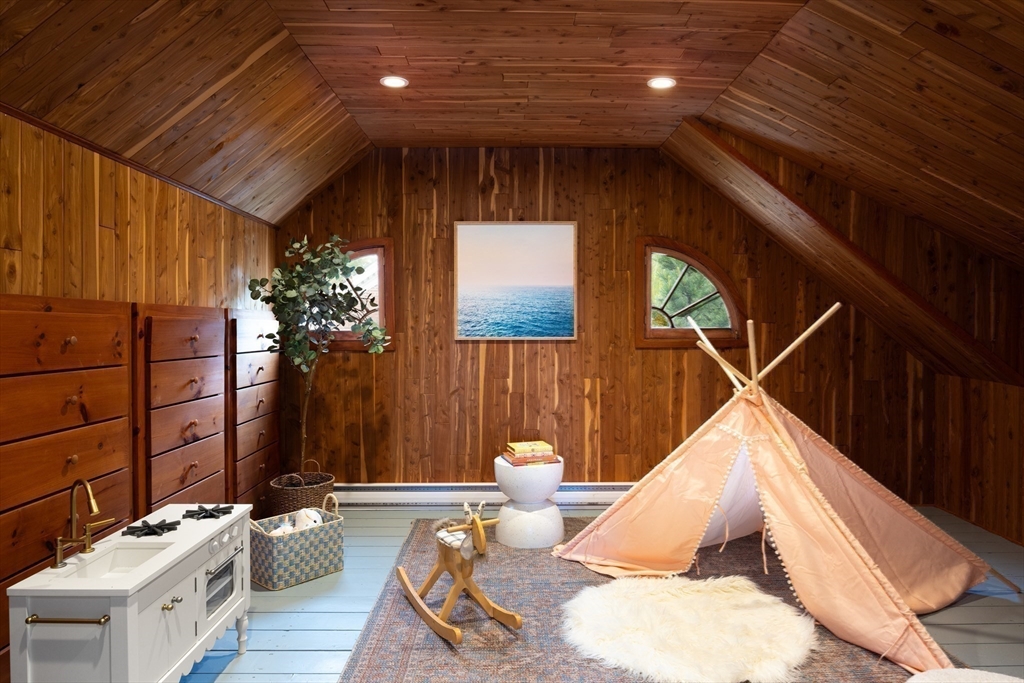 37 Randolph Road Brookline, MA 02467 - Photo 16 of 20 a living room with furniture and flower plants