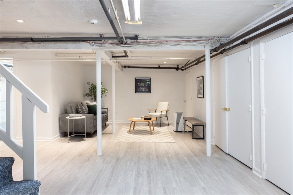 37 Randolph Road Brookline, MA 02467 - Photo 17 of 20 a living room with furniture and a wooden floor