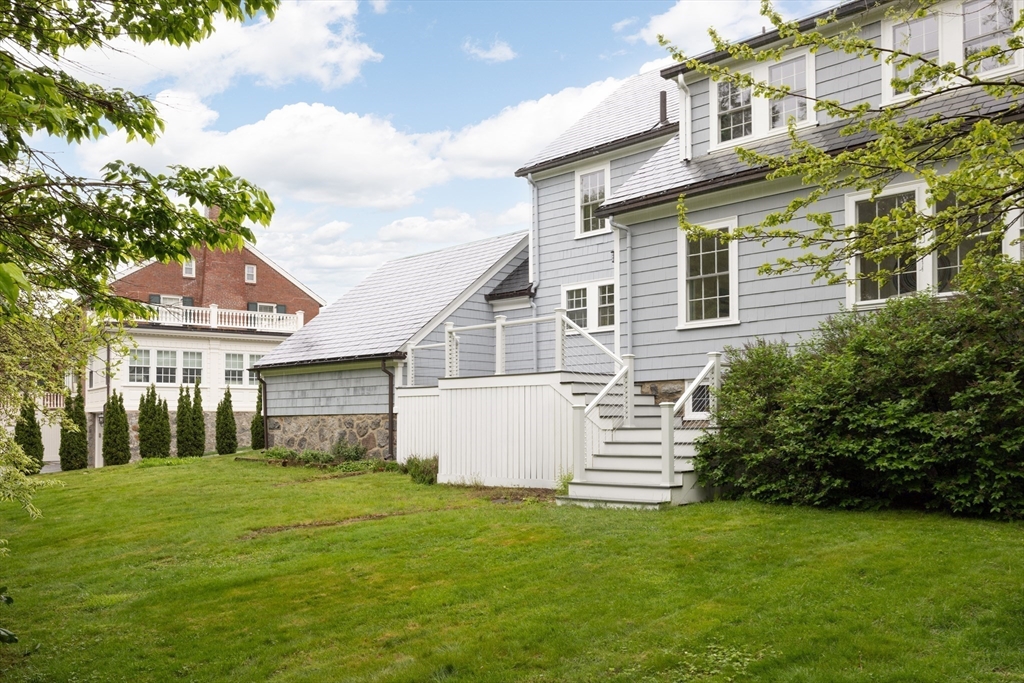 37 Randolph Road Brookline, MA 02467 - Photo 19 of 20 a front view of a house with a garden
