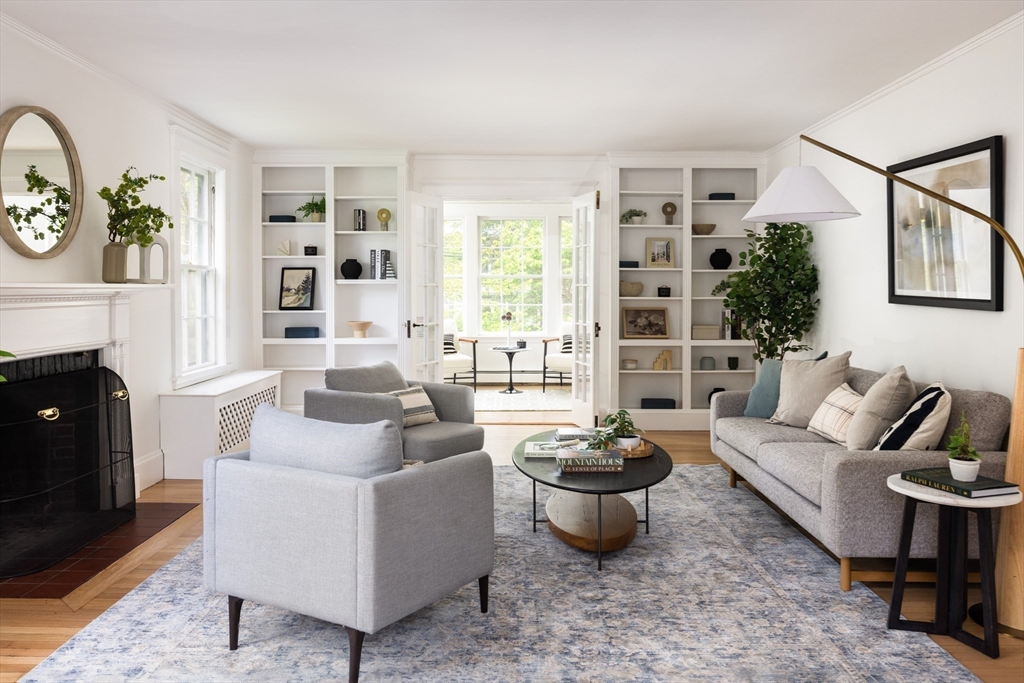 37 Randolph Road Brookline, MA 02467 - Photo 4 of 20 a living room with furniture potted plant and a fireplace