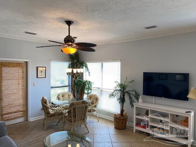 16590 Perdido Key Drive, Unit 5A Perdido Key, FL 32507 - Photo 12 of 24 a living room with furniture and a flat screen tv