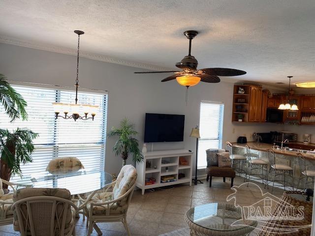 16590 Perdido Key Drive, Unit 5A Perdido Key, FL 32507 - Photo 13 of 24 a dining room with furniture and a flat screen tv