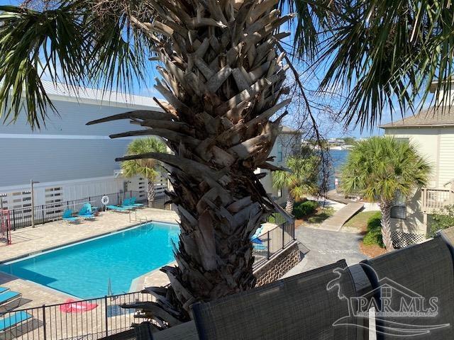 16590 Perdido Key Drive, Unit 5A Perdido Key, FL 32507 - Photo 14 of 24 a view of a swimming pool with chairs