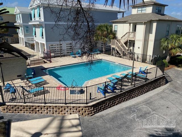 16590 Perdido Key Drive, Unit 5A Perdido Key, FL 32507 - Photo 15 of 24 a view of a chairs and table in the patio