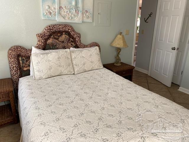 16590 Perdido Key Drive, Unit 5A Perdido Key, FL 32507 - Photo 20 of 24 a bedroom with a bed and a couch