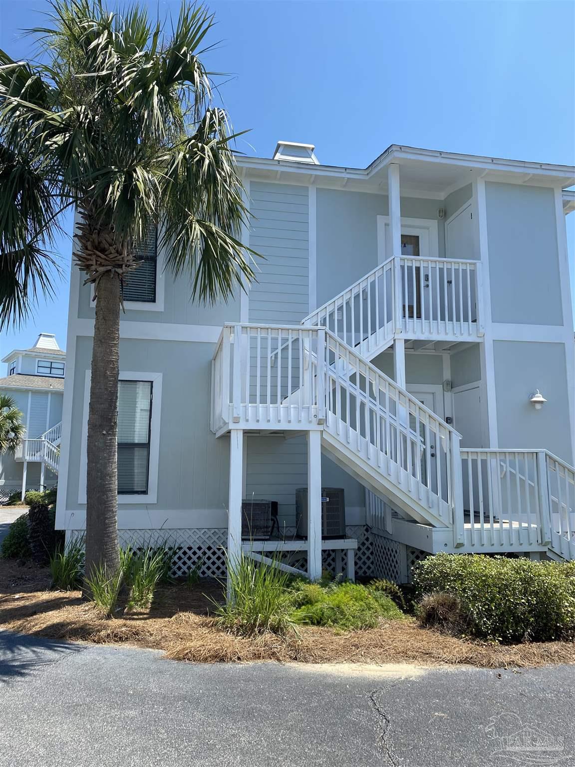 16590 Perdido Key Drive, Unit 5A Perdido Key, FL 32507 - Photo 22 of 24 a view of front of house with a yard