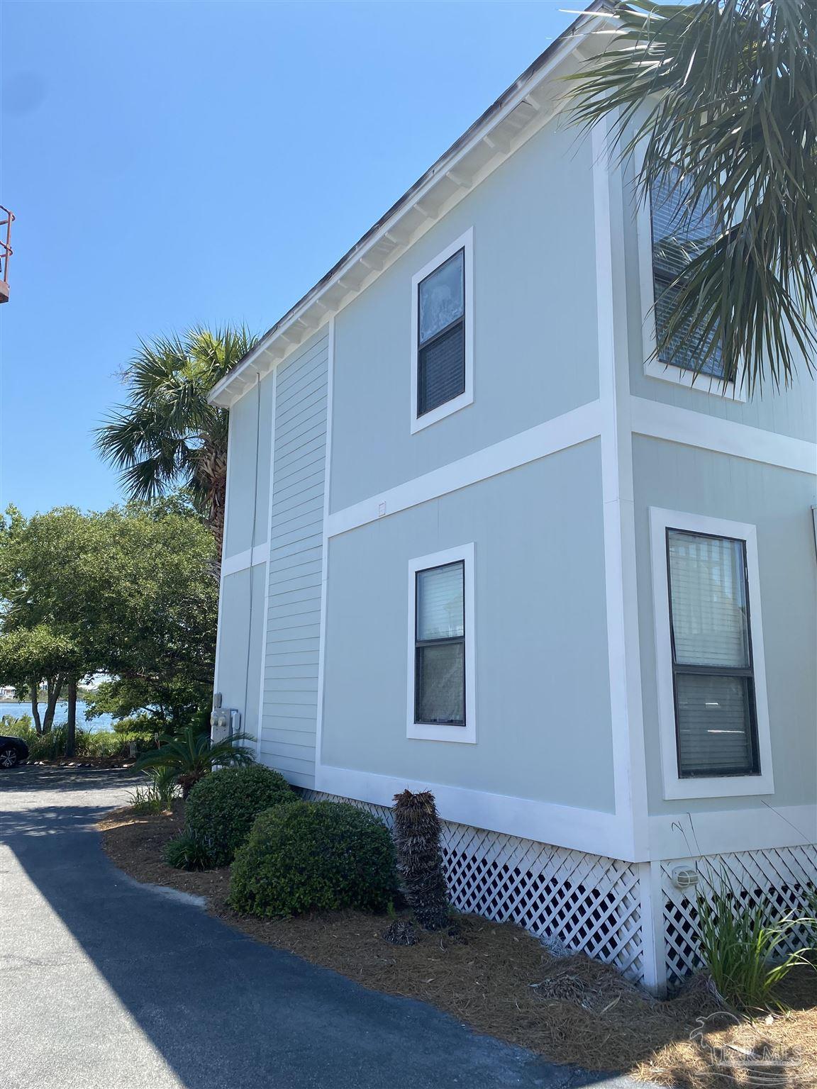 16590 Perdido Key Drive, Unit 5A Perdido Key, FL 32507 - Photo 23 of 24 a front view of a house with a yard