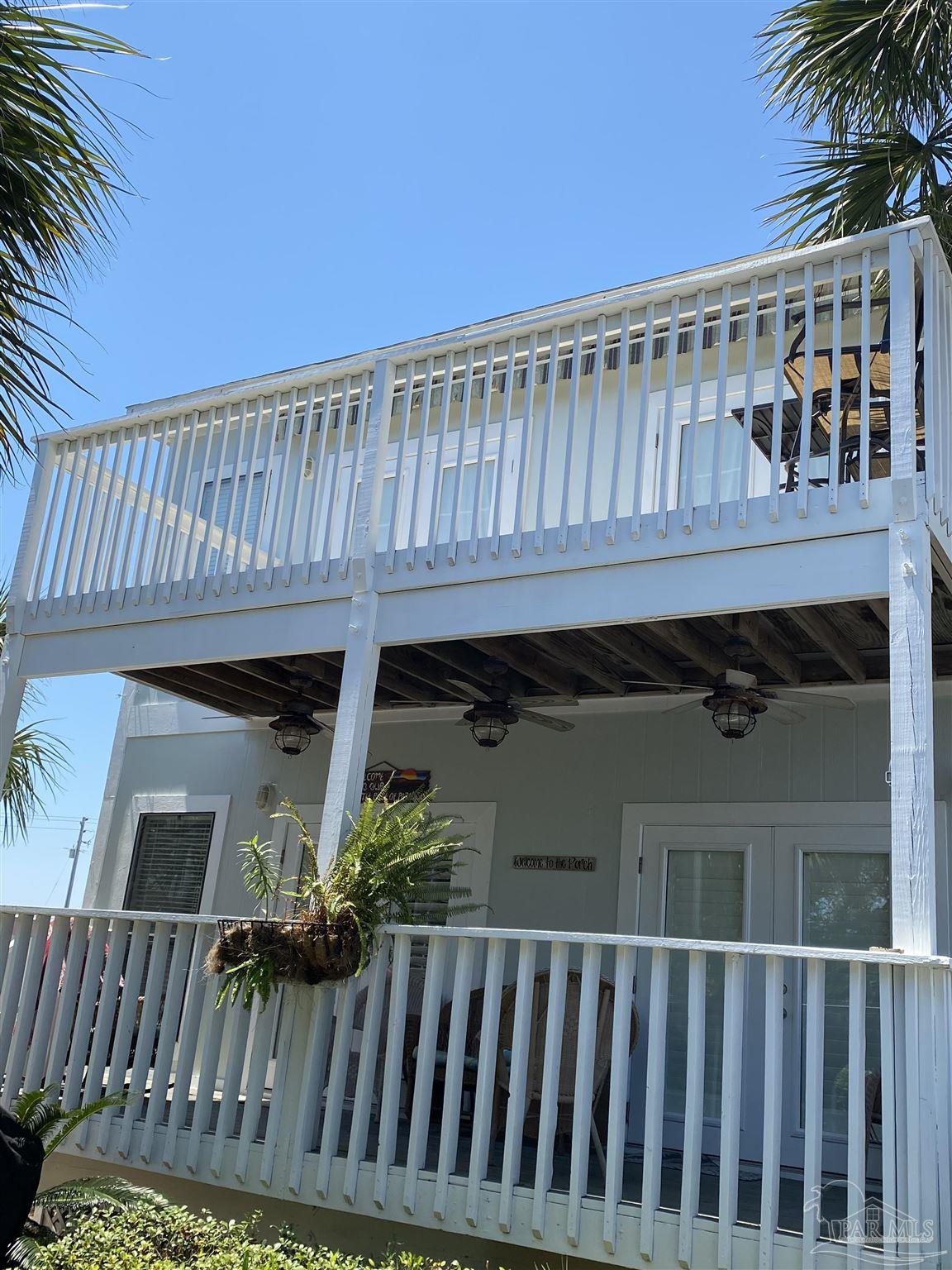 16590 Perdido Key Drive, Unit 5A Perdido Key, FL 32507 - Photo 24 of 24 a view of a house with a wooden fence