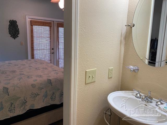 16590 Perdido Key Drive, Unit 5A Perdido Key, FL 32507 - Photo 7 of 24 a bathroom with a sink and a mirror