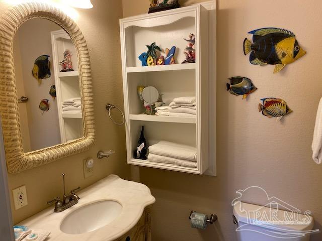 16590 Perdido Key Drive, Unit 5A Perdido Key, FL 32507 - Photo 8 of 24 a bathroom with a sink mirror and vanity