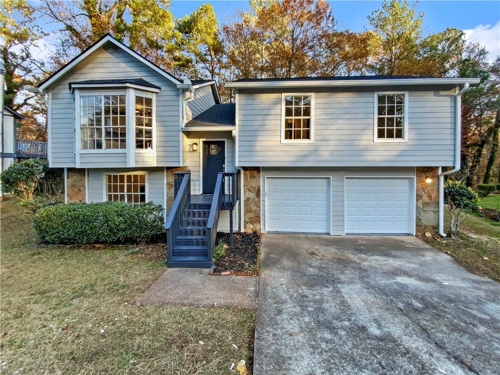 2675 Knollberry Lane Decatur, GA 30034 - Photo 1 of 1 a front view of a house with a yard and garage