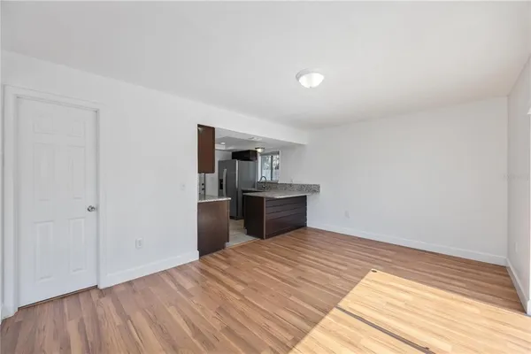 a kitchen with a refrigerator and a sink