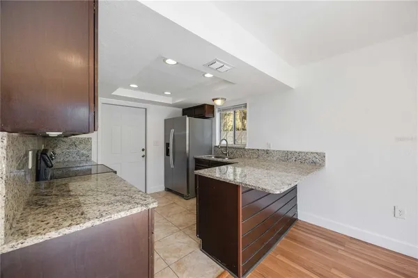 a kitchen with a stove and a sink