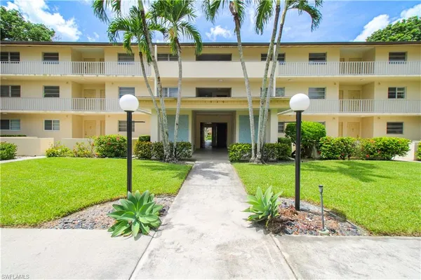 a front view of a building with garden