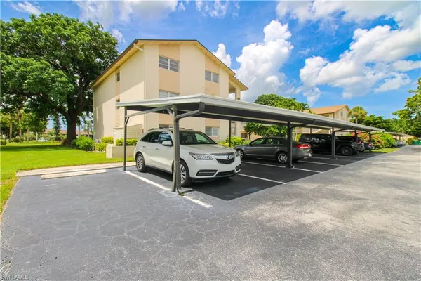 a view of car parked in front of house