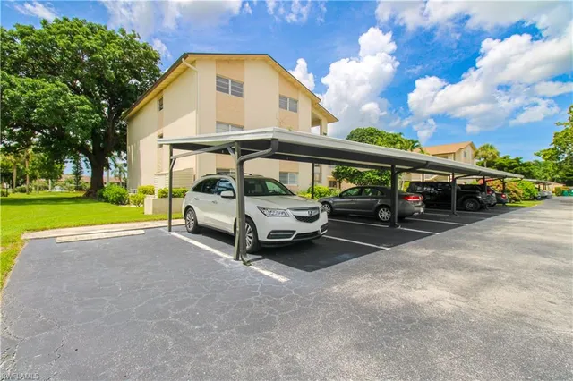 a view of car parked in front of house