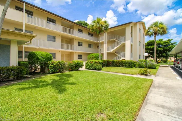 a front view of a building with garden