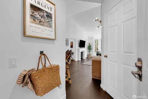 a kitchen with granite countertop stainless steel appliances a sink stove top oven and cabinets