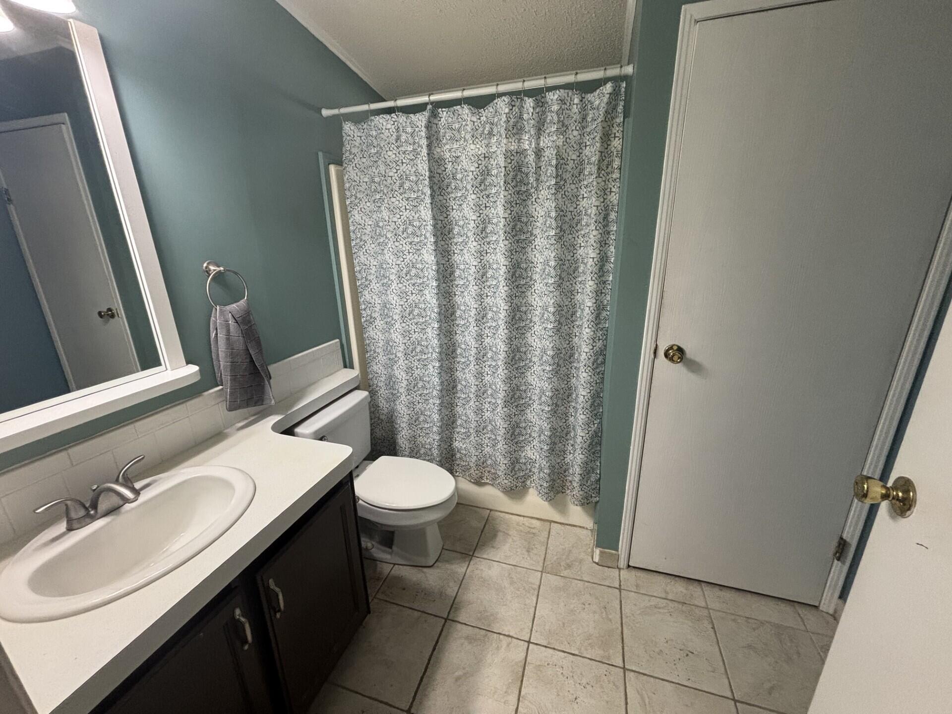 6567 Northwest 34th Avenue Pompano Beach, FL 33073 - Photo 24 of 30 a bathroom with a sink and a toilet