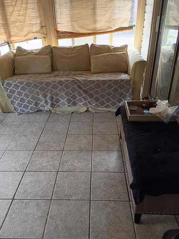 a kitchen with a sink and a stove next to a window