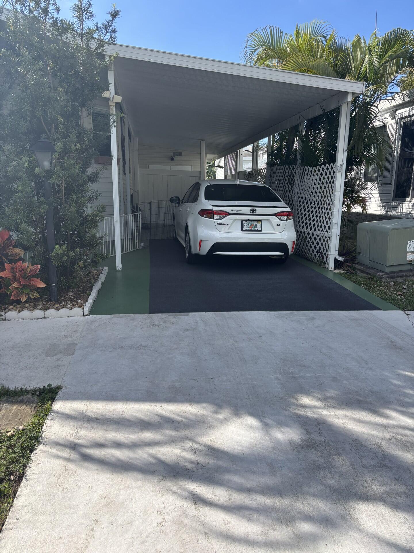 6567 Northwest 34th Avenue Pompano Beach, FL 33073 - Photo 4 of 30 a car parked in front of building