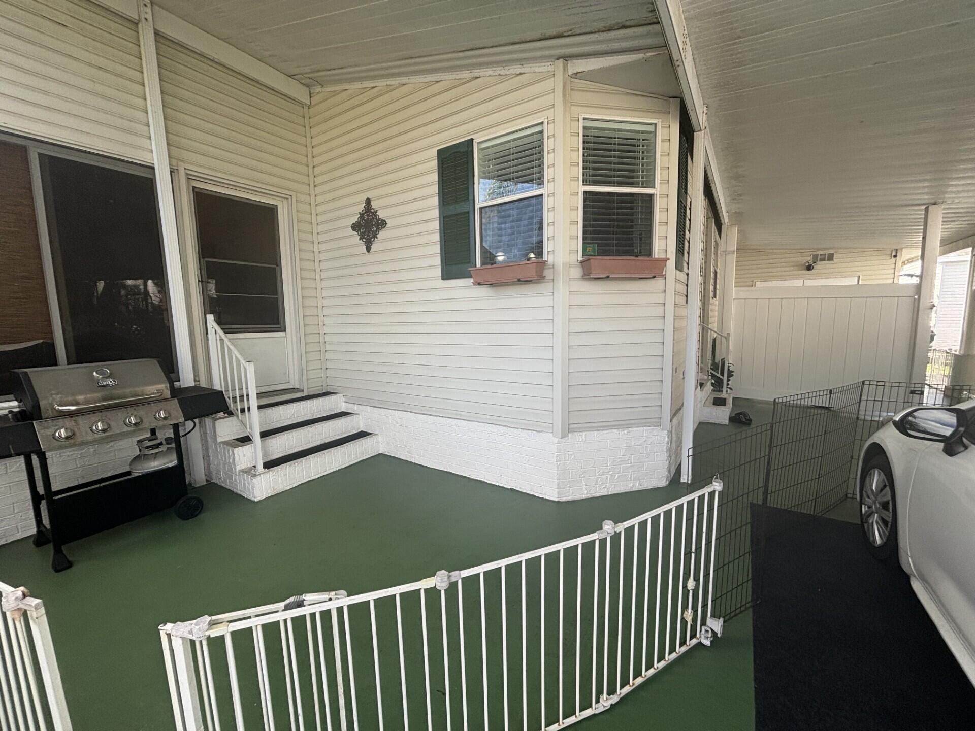 6567 Northwest 34th Avenue Pompano Beach, FL 33073 - Photo 6 of 30 a view of a balcony with chairs