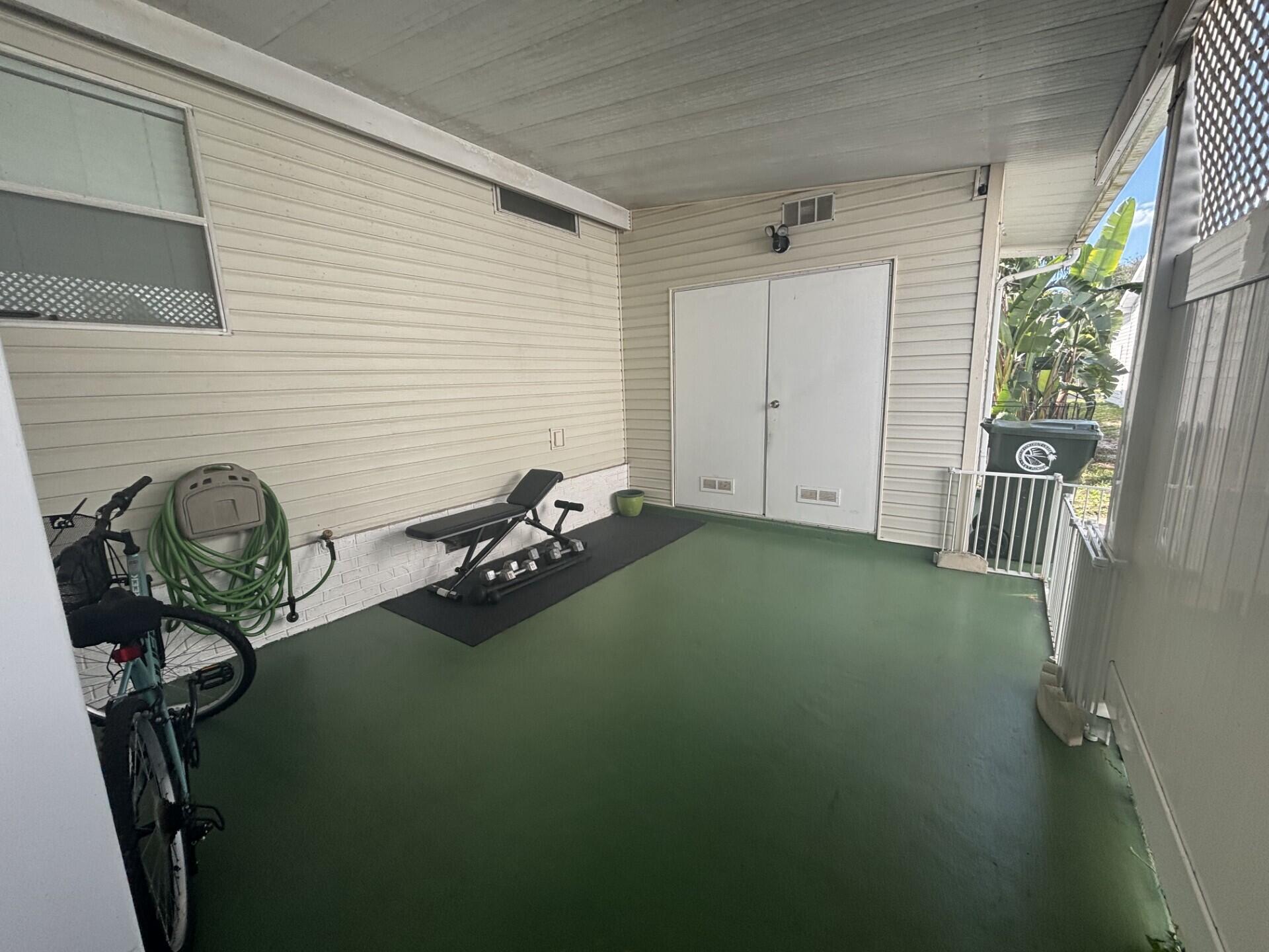 6567 Northwest 34th Avenue Pompano Beach, FL 33073 - Photo 8 of 30 a view of a room with gym equipment