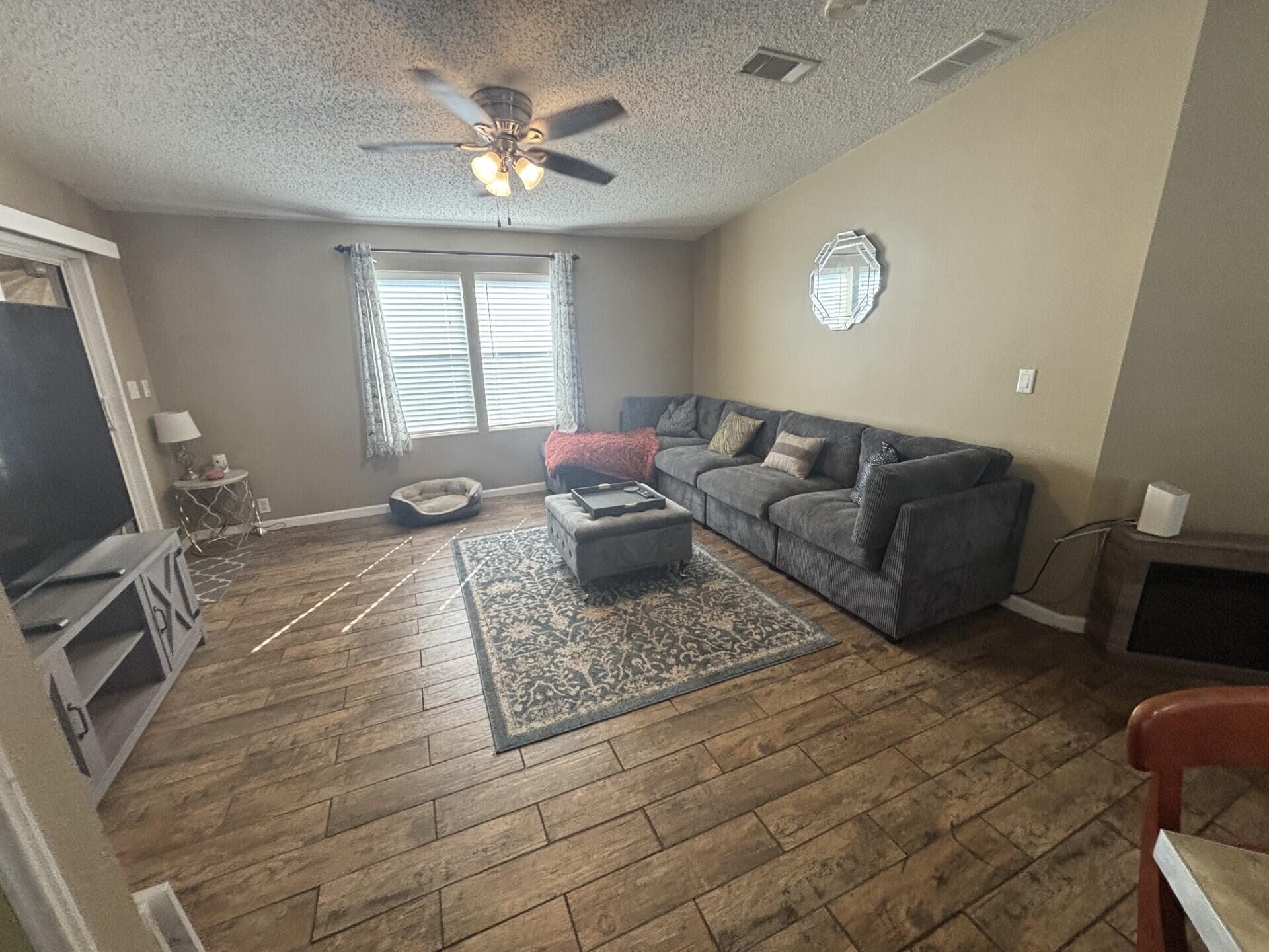 6567 Northwest 34th Avenue Pompano Beach, FL 33073 - Photo 10 of 30 a living room with furniture and a window
