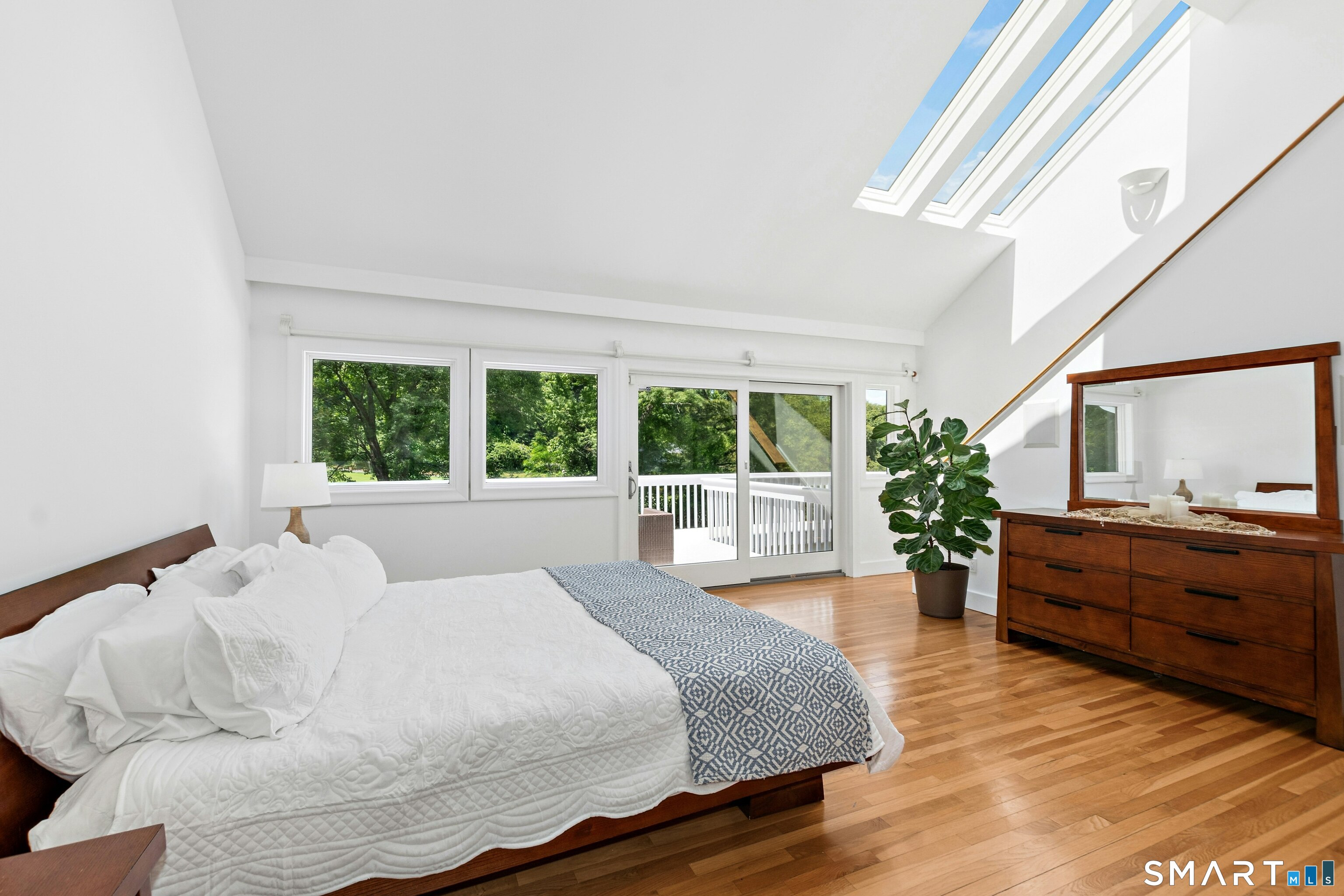 38 Old Redding Road Weston, CT 06883 - Photo 15 of 40 The first floor Primary Suite has high vaulted ceilings and offers a walk-in closet and fabulous full bathroom with sauna.