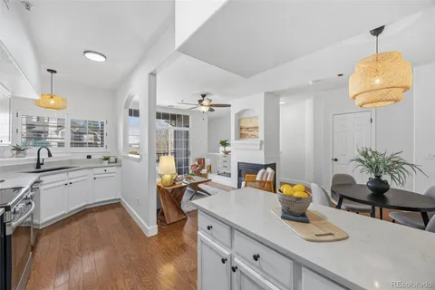 a kitchen with sink refrigerator and stove