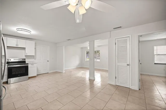 a view of a kitchen with a sink and a stove top oven