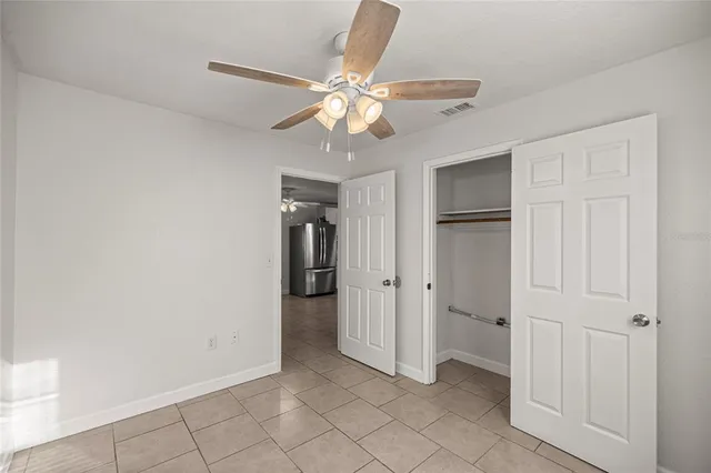 a view of an entryway with a ceiling fan