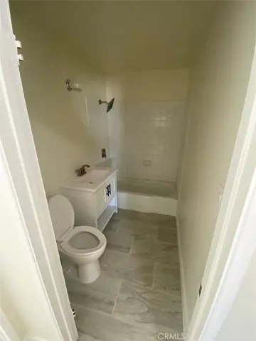a bathroom with a sink and toilet