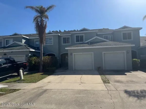 a house view with a garden space