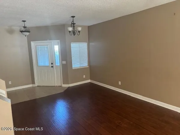 a front view of a house with parking space