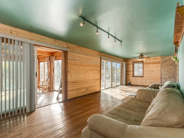 a view of a livingroom with furniture and wooden floor
