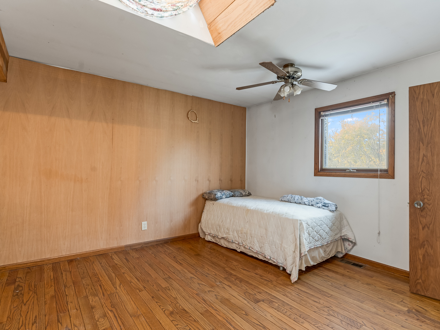72 Largemouth Lane Wilmington, IL 60481 - Photo 20 of 34 a bedroom with a bed chandelier and a window