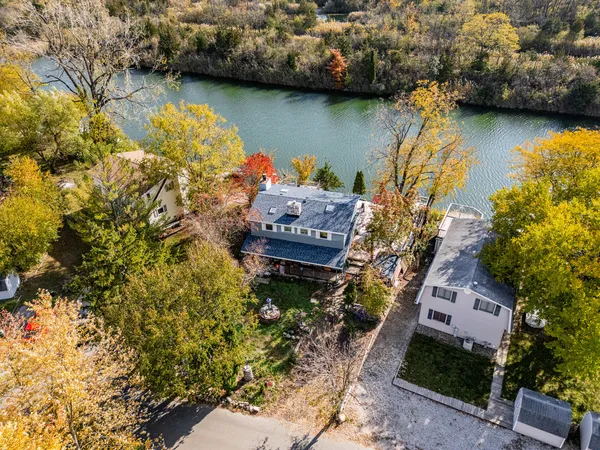 a aerial view of a house with a yard
